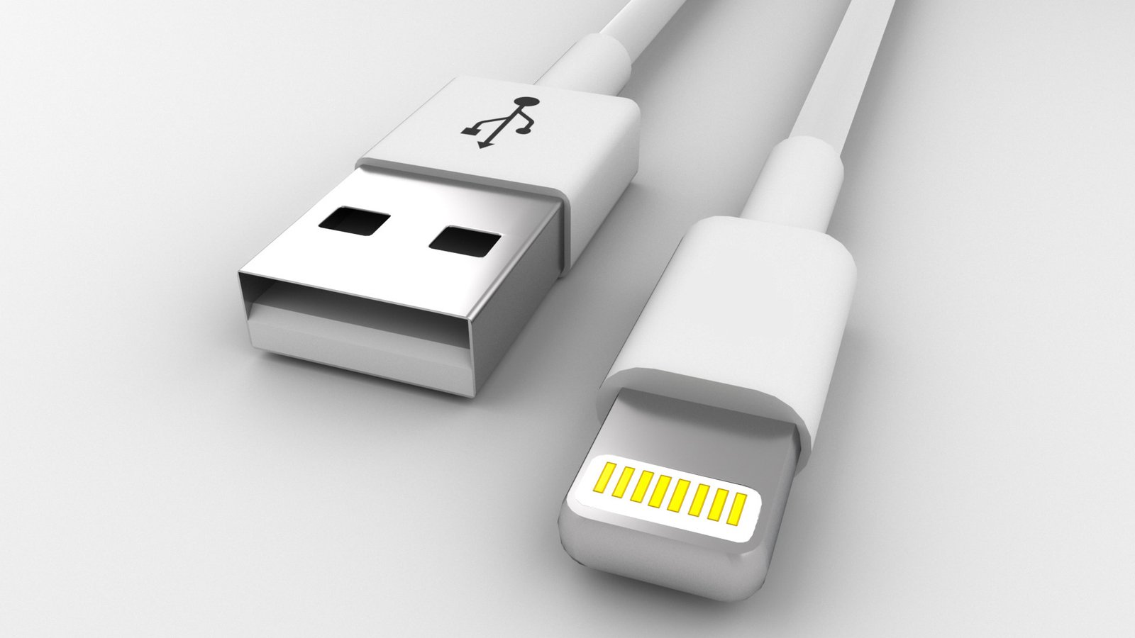 Render of a white USB to Lightning cable, both connectors on a pale grey surface